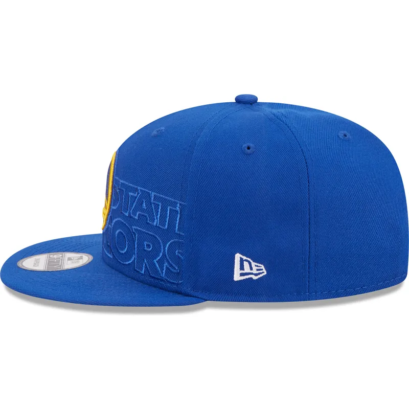 kapa-ravna-plava-snapback-9fifty-draft-edition-2023-golden-state-warriors-nba-new-era kapa-ravna-plava-snapback-9fifty-draft-edition-2023-golden-state-warriors-nba-new-era